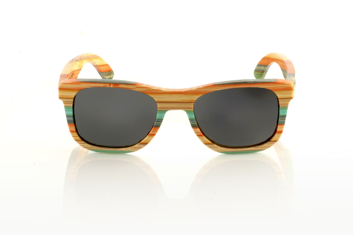 Wood eyewear of Bamboo KASHBAH. KASHBAH sunglasses, with a classic design and a slightly smaller size than the standard, make the difference in our bamboo collection. These glasses are made of vertically laminated bamboo wood, creating a pattern of soft colors that capture the light and the gaze of whoever sees them. The colorful result is not only visually attractive, but also adds a touch of originality and freshness to your style. With measurements of 143x46 and a caliber of 52, the KASHBAH are perfect for those looking for comfortable, light glasses with a unique touch that will not go unnoticed. for Wholesale & Retail | Root Sunglasses® 